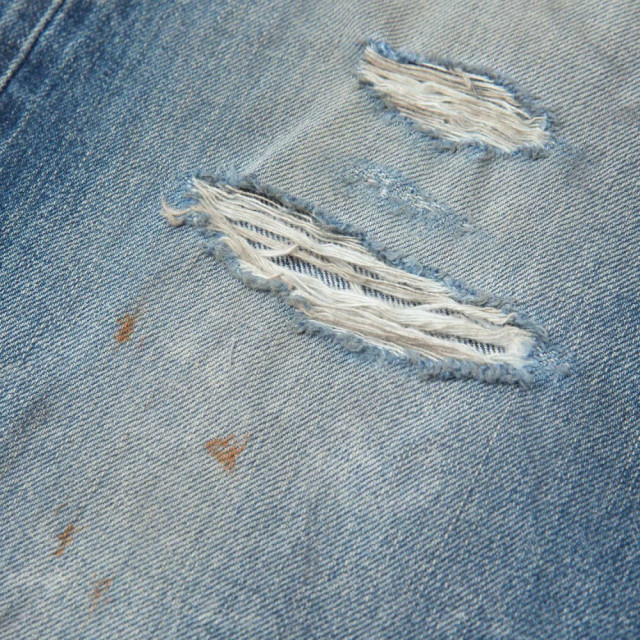 MADNESS HARD AGING DENIM PANTS. RELAXED